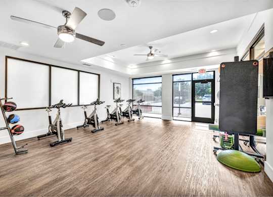 Large open gym with bikes at Markethaus 3700 in Plano Texas