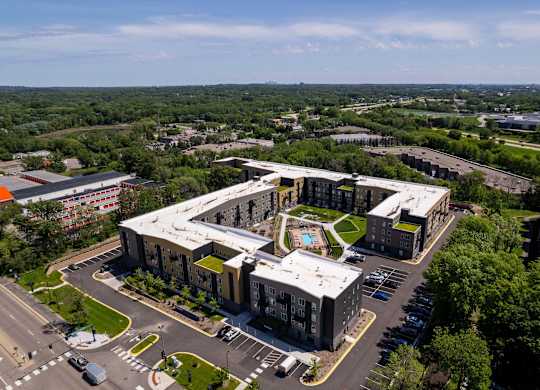 A large building with a parking lot in front of it.