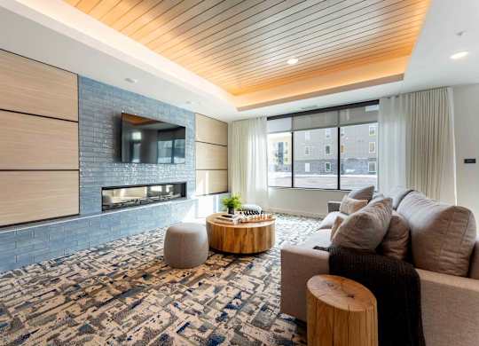 A modern living room with a fireplace and a couch.