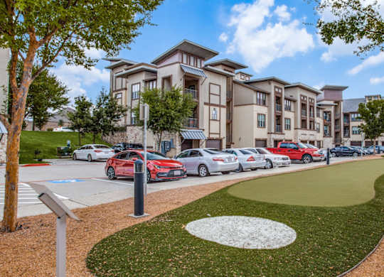 A row of cars parked at Twin CreeksCrossing in Allen, TX.