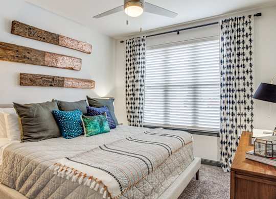 Bright bedroom at Twin Creeks Crossing, one bedroom apartments in Allen, TX