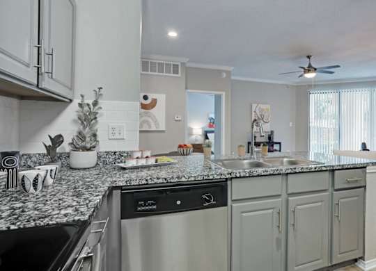 Kitchen with shaker-style cabinets at The Lana, apartments in Dallas, TX