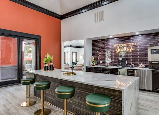 Clubhouse interior with lounge seating at The Lana, Dallas apartments