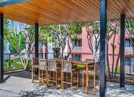 Outdoor seating area surrounded by landscaping at The Lana