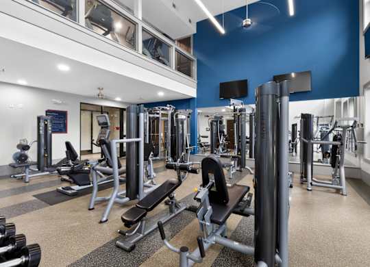 Fitness equipment at The Carson at Twin Creeks, Allen apartments