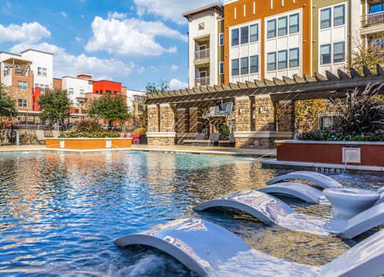 Outdoor swimming pool at The Carson at Twin Creeks, apartments in Allen, TX