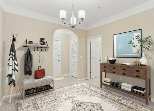 A hallway with a bench, coat rack, and a painting on the wall.