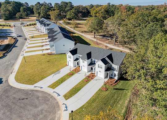 a group of houses on the side of a road