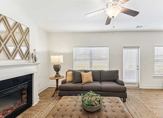 a living room with a couch and a fireplace