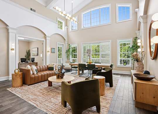 A living room with a brown couch and a wooden coffee table.