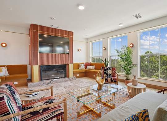 A living room with a fireplace and a television.