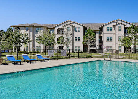 Large pool with sun chairs