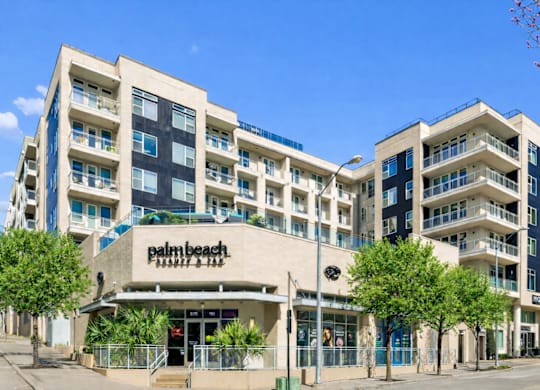 A large building with the word "Palm Beach" on the front.