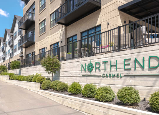 a large building with a sign that reads north end apartment complex