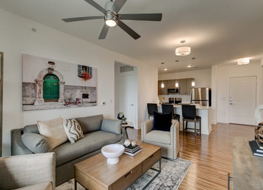 a living room with a couch and two chairs
