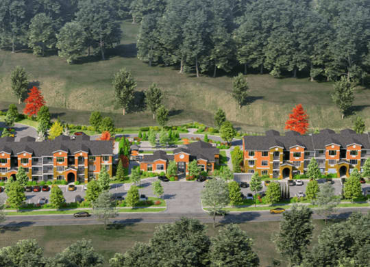 an aerial view of a subdivision with houses and trees