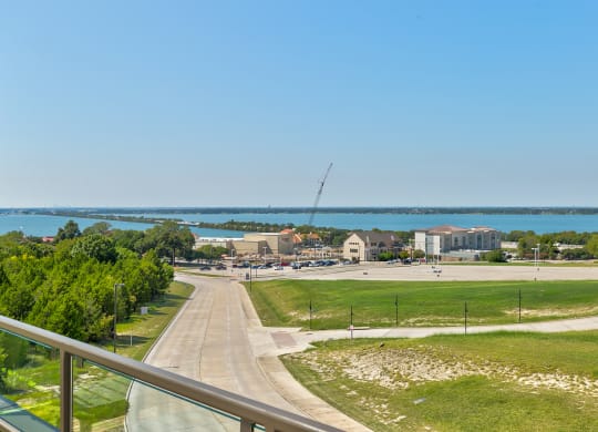 a view of the lake and a city from a balcony