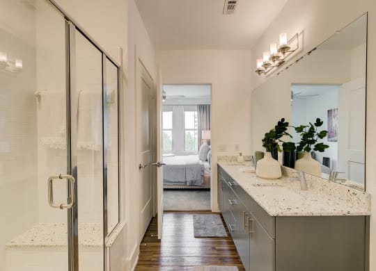 a bathroom with a glass shower stall