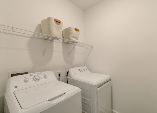 a laundry room with a washer and dryer