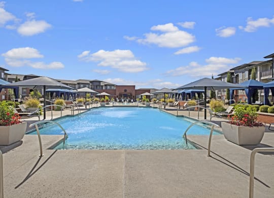 a swimming pool at the resort on a sunny day