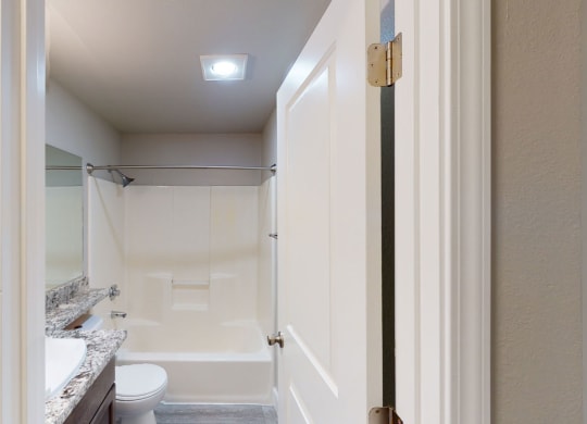 a bathroom with a toilet and a sink