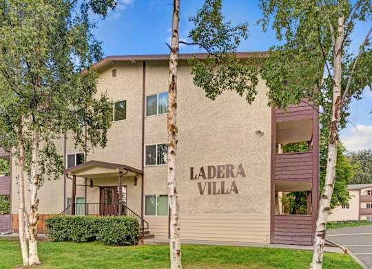 The Ladera Villa apartment building with a large wall printing the name