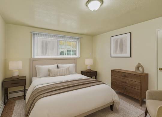 A bedroom with a bed, nightstand, and chair.