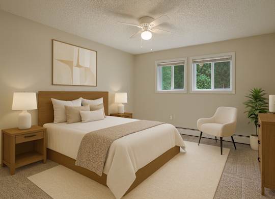 A bedroom with a large bed, a chair, and a plant.