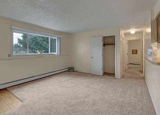 A room with a window and a door.