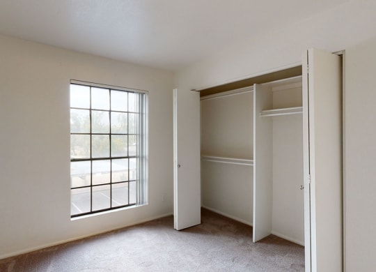 Bedroom 2 with window and closet