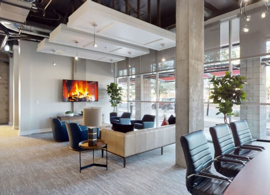 a room with a fireplace and a table and chairs