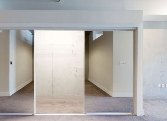 an empty room with a wall that has been painted white