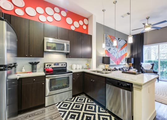 a kitchen with stainless steel appliances and a counter top