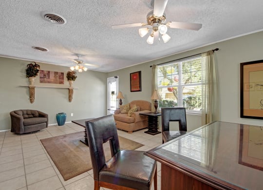 a dining room and living room with a table and chairs
