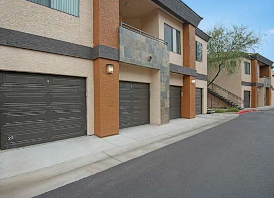 A row of houses with garage doors closed.