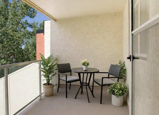 A private covered balcony here at 3600 Brentwood with a secure railing and peaceful outdoor views, creating a relaxing spot for fresh air and sunshine.