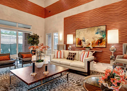 A living room with a leopard print rug and a painting on the wall.
