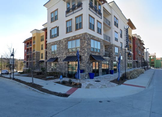 an apartment building on the corner of a street
