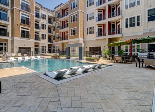 a swimming pool in the middle of an apartment building