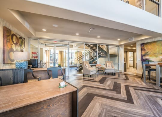a living room with a wood floor and a staircase