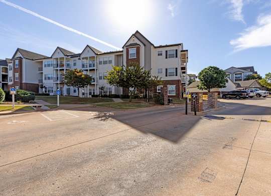 A sunny day at a residential complex with a clear blue sky.