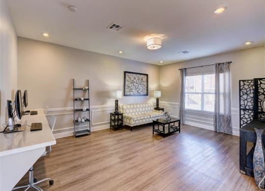 Residence at North Penn entertainment room with sitting area and bright natural lighting