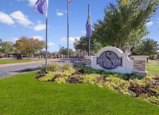 Stoneleigh sign with two flags on either side.