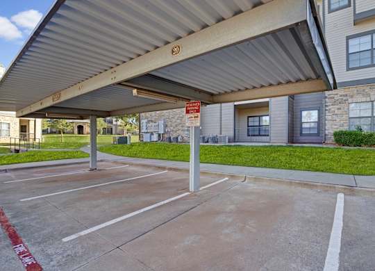 A parking lot with a red line painted on the ground.