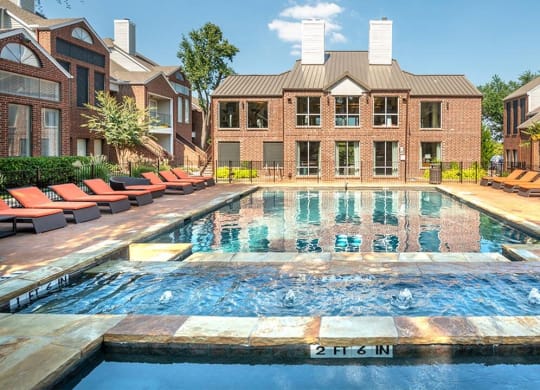 Lakewood on the Trail poolside view with lounge chairsLakewood on the Trail poolside view with lounge chairs Downtown Dallas Apartment with pool rental