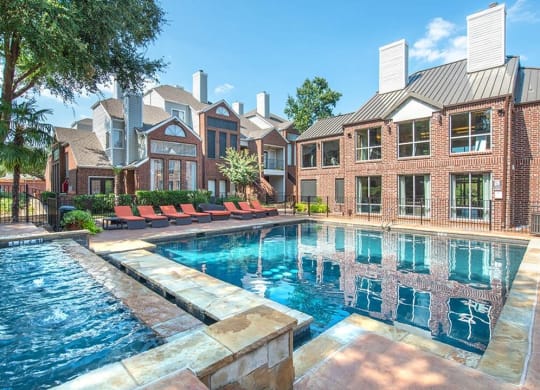 Lakewood on the Trail poolside view with lounge chairs Dallas, Texas Apartment with indoor hot tub