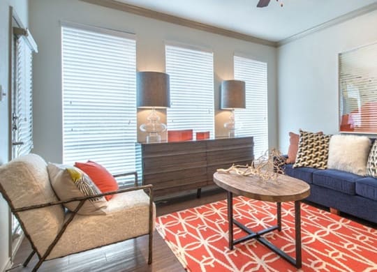 a living room with a couch and a table