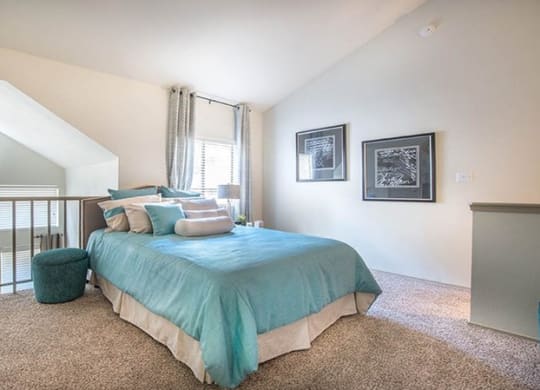 a bedroom with a bed and a balcony