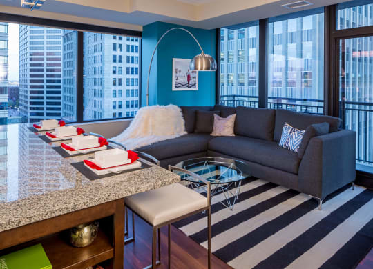 Nic on 5th Apartments in Minneapolis, Minnesota- Furnished large living room with floor to ceiling views of Downtown West Minneapolis