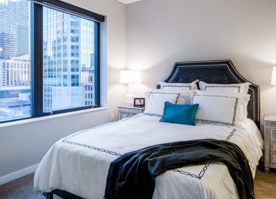 Nic on 5th Apartments in Minneapolis, Minnesota- Amazing views of Downtown West Minneapolis from bedroom with wooden floors